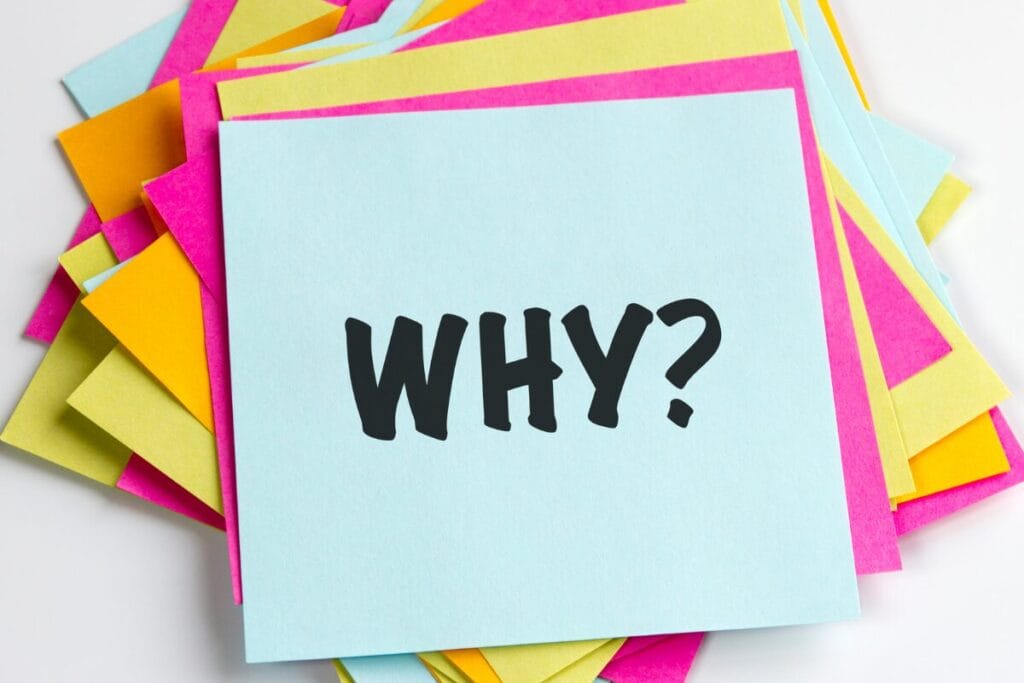 Colorful sticky notes with the word “why” representing reflection on why morning routines fail.